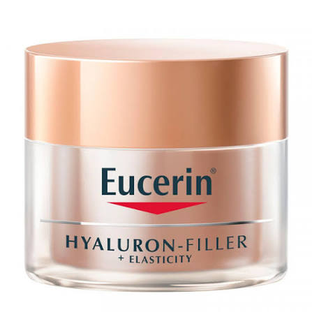 Eucerin Hyaluron-Filler + Elasticity Soin de Jour SPF15 est un soin anti-âge spécialement formulé pour atténuer les signes avancés du vieillissement cutané et améliorer visiblement la fermeté et l’élasticité de la peau. Sa formule associe le Complexe Collagène-Élastine, composé d’Arctiine et de Créatine, qui stimule la production naturelle de collagène et aide à renforcer l’élasticité cutanée. La peau paraît plus ferme, plus tonique et mieux structurée. Ce soin agit également sur les taches brunes liées à l’âge grâce au Thiamidol, un actif breveté qui réduit visiblement l’apparence des taches pigmentaires et contribue à unifier le teint, avec des résultats visibles dès 2 semaines d’utilisation. Enrichi en acide hyaluronique de haut et bas poids moléculaire, il aide à hydrater intensément la peau et à combler les rides, même profondes, pour une peau plus lisse et repulpée. Sa formule est complétée par un SPF15 qui aide à protéger la peau des agressions extérieures et du photovieillissement, tout en offrant confort et hydratation au quotidien.
